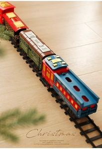 Detailed macro view of vintage retro toy train carriages on black plastic circular tracks