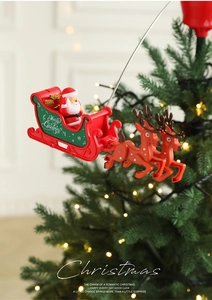 Rotating Santa sleigh and reindeer Christmas tree topper with festive gift boxes