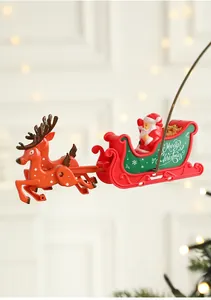 Rotating Santa Claus on reindeer sleigh decoration with Merry Christmas lettering on the side