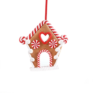 Gingerbread house Christmas tree ornament with candy cane trim and a red hanging ribbon