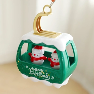 Rotating Christmas tree topper with Santa, elk, and cable car cabin hanging ornament