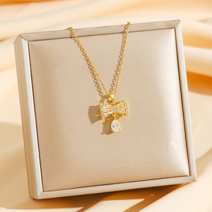 Exquisite gold bow necklace with micro-pave crystals and pear-cut zircon waterdrop pendant