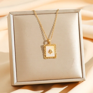 Golden spade heart pendant necklace with natural mother of pearl shell in vintage frame