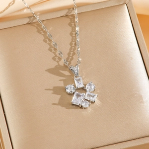 Sparkling zircon geometric pendant necklace set in silver finish on a premium jewelry box