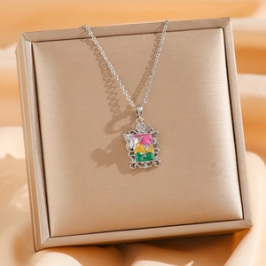 Vintage Monet garden rose and butterfly pendant necklace in silver stainless steel