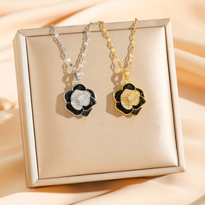 Vintage camellia pendant necklace with layered petals and diamonds in gold and silver finish