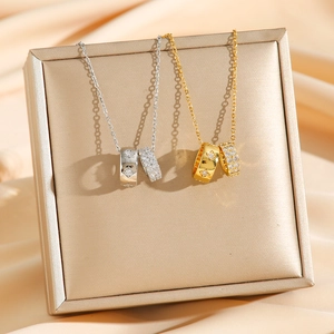 Elegant double-ring titanium steel necklace with full crystal paving in gold and silver finish