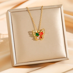 Luxurious gold necklace with colorful zircon butterfly pendant on champagne silk background