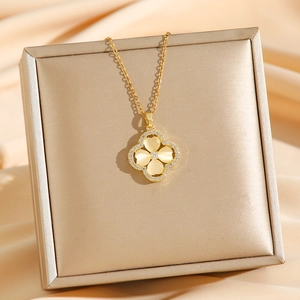 Luxury gold titanium steel necklace with opal clover flower pendant on satin background