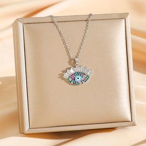 Collier vintage œil de protection en cuivre plaqué or avec zircons colorés sertis