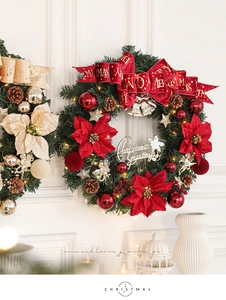 Detail of Christmas wreath with LED lights, velvet flowers, and festive ornaments on wall