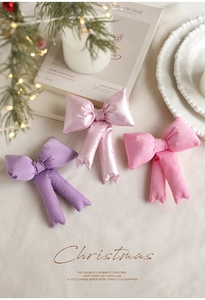Three 3D stuffed bows in pink and purple for Christmas tree topper decoration