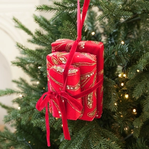 Detail showing red velvet Christmas gift box hanging ornament with gold sequins
