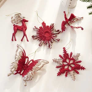 Red glitter Christmas tree ornaments featuring reindeer, snowflake and bird designs