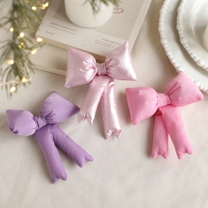 Three assorted fabric bow ornaments for mini Christmas tree toppers and decor
