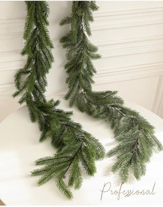 Detailed view of artificial PE pine needle rattan for Christmas wall and door decoration
