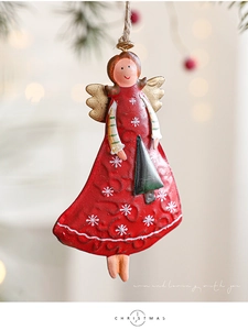 Detailed view of vintage iron Christmas angel ornament with snowflake pattern and jute rope