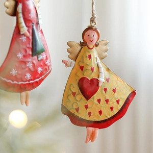 Vintage metal Christmas angel ornaments with snowflake and heart patterns for tree decor