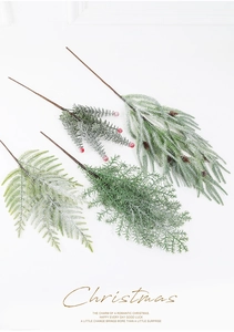 Detailed snowy Christmas pine branch with red berries and pinecones for festive decor