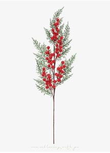 Detail of artificial Christmas sprig with glossy red berries and green pine needles