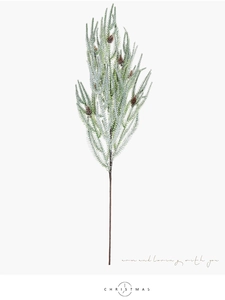 Close-up of frosted artificial Christmas pine branch with small brown pine cones