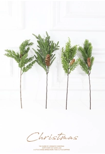 Close-up of artificial pine branches with natural pine cones for Christmas decoration