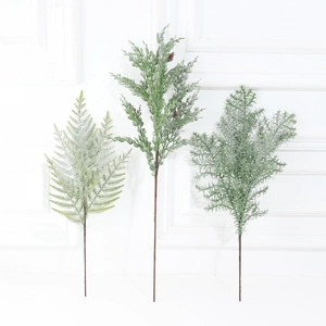Artificial Christmas branches with snow effect and frosted green pine needles decoration