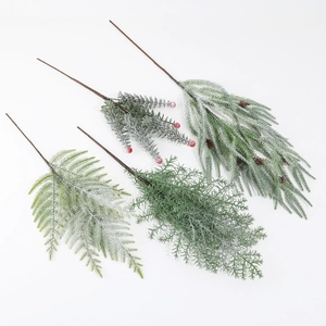 Artificial Christmas frosted pine branches with red berries and pine cones for decor