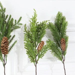 Artificial evergreen pine branches with pinecones for Christmas wreaths and home decor