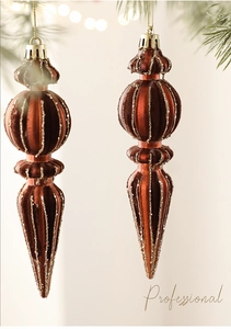 Detail of rust-red flocked Christmas icicle ornaments with gold glitter lines