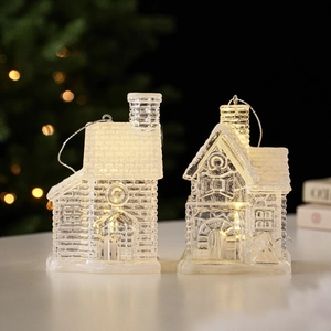 Luminous clear Christmas house ornaments with warm LED lights for festive tree decoration