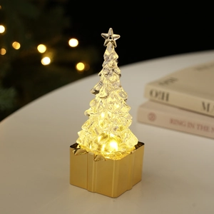 Luminous transparent Christmas tree tabletop ornament with gold base and warm LED star light