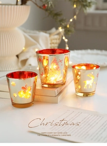 Trois photophores de Noël en verre doré avec motifs de rennes et effet étoilé à LED