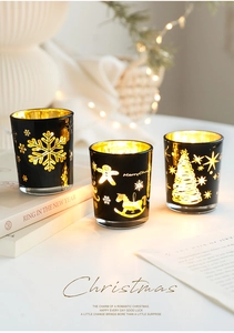 Trois photophores de Noël élégants en verre noir et or avec motifs de flocons et de sapins