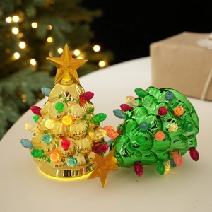 Golden and green glowing Christmas tree table ornaments with colorful bead lights