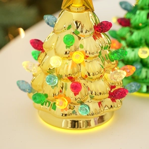Golden light-up Christmas tree table ornament with colorful bulbs and star topper