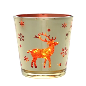 Photophore de Noël en verre doré avec motifs de rennes rouges et lumière chaude