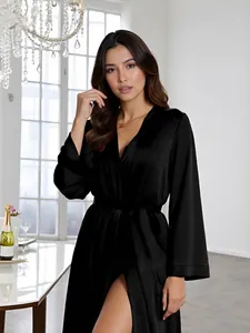Detail of elegant black satin robe with a deep V-neck and a silky smooth texture