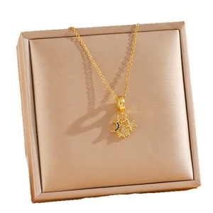 Elegant gold titanium steel necklace with sun, moon and star charms and blue zircons