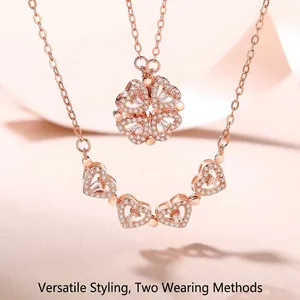 Rose gold magnetic necklace with sparkling heart charms forming a clover shape