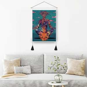 Psychedelic skull yoga tapestry with wooden rod and black tassels on white wall