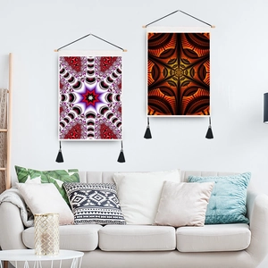 Modern mandala wall tapestries with wooden rods and black tassels in a white living room