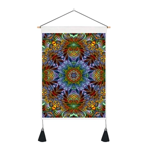 Detail of mandala tapestry with wooden hanger, black tassels and vibrant fractal pattern