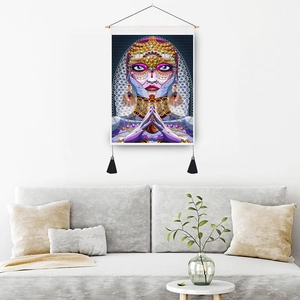 Bohemian style abstract female portrait tapestry hanging on a minimalist living room wall