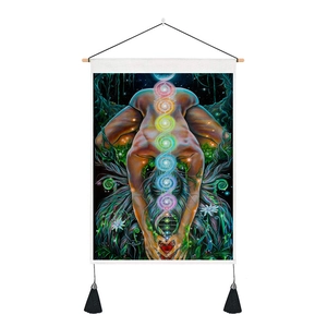 Detail of yoga chakra tapestry with seven energy centers and decorative black tassels