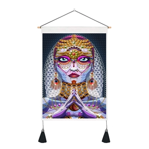 Detail of bohemian tapestry featuring vibrant exotic artwork and wooden hanging frame