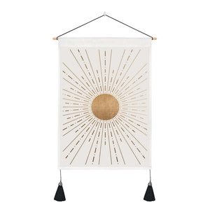 Minimalist sun tapestry with golden rays, wooden hanging rod and black tassels