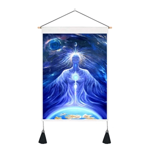 Detail of bohemian tapestry featuring a glowing blue mystical figure with black tassels