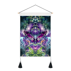 Macro shot of ethnic Indian butterfly tapestry showing detailed mandala patterns and tassels