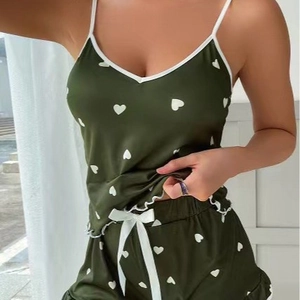 Women's dark green satin pajama set with white heart prints and ruffles